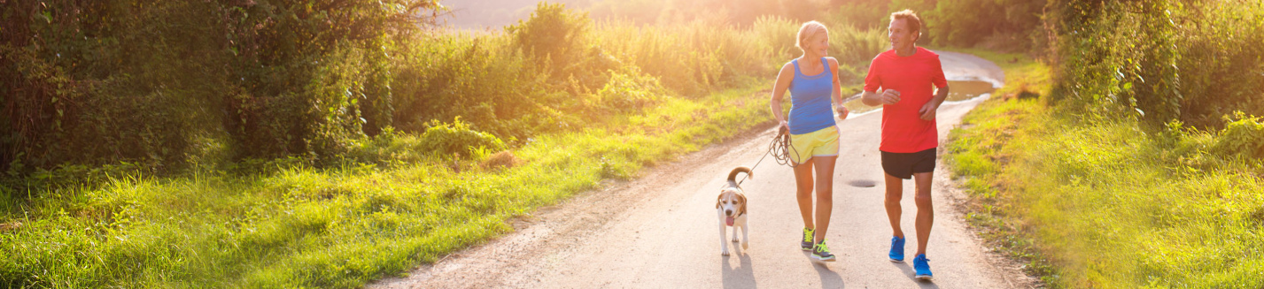 banner photo of couple with dog